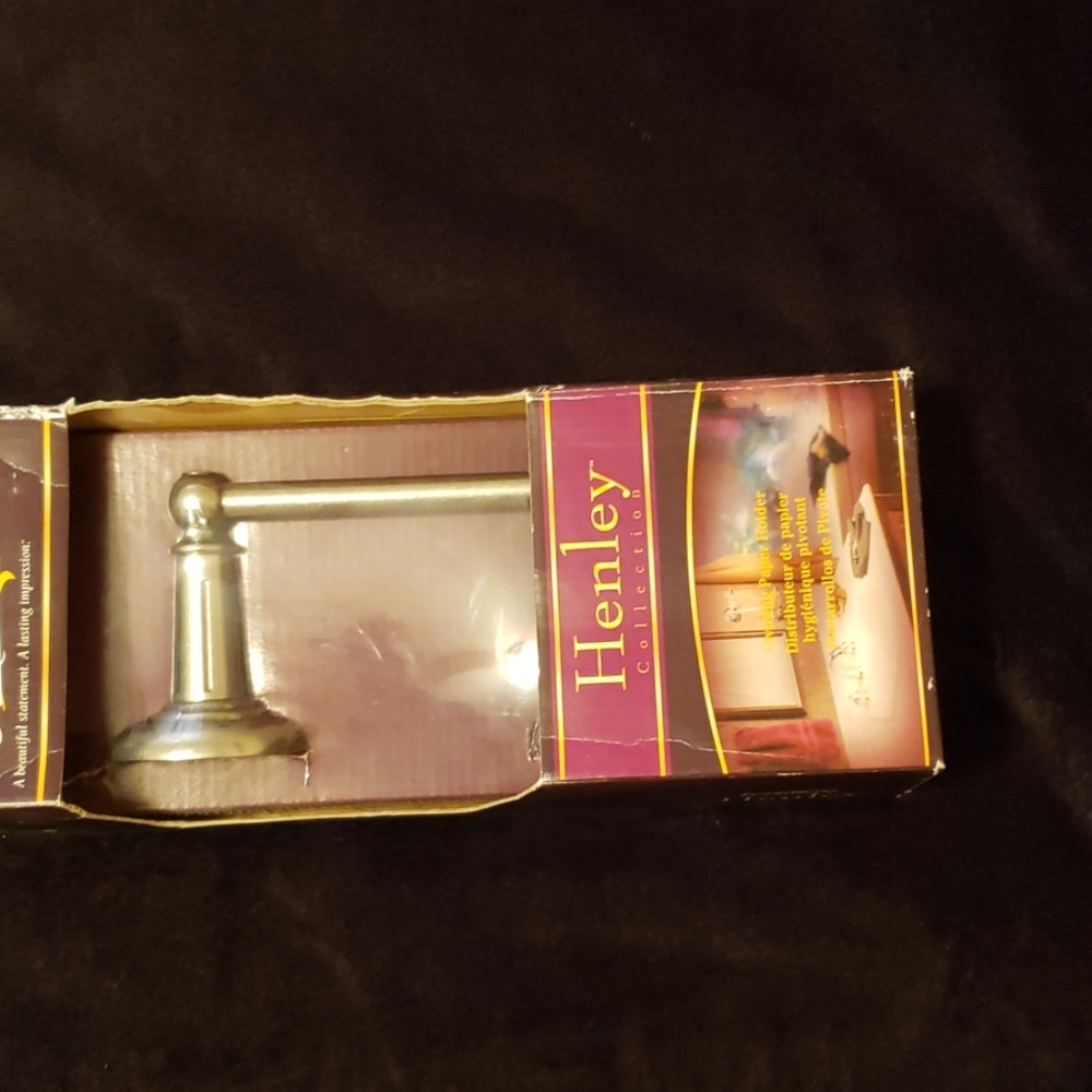 pivoting toilet paper holder